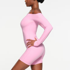 FITS EVERYBODY PICOT TRIM OFF THE SHOULDER ONESIE | BUBBLE GUM ON A MODEL SIDE VIEW