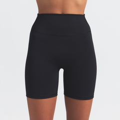 NikeSKIMS MATTE 5" BIKER SHORT | OBSIDIAN ON A MODEL FRONT VIEW