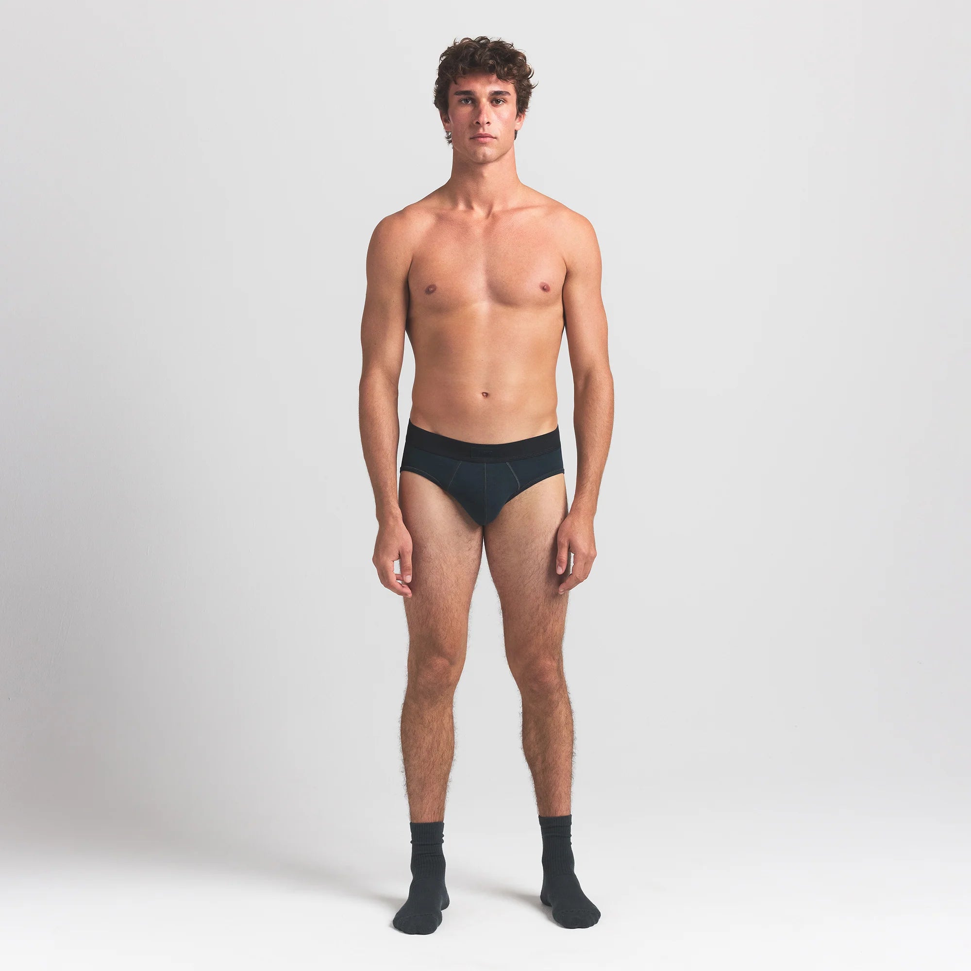 SKIMS COTTON MENS BRIEF 3-PACK | VERDANT MULTI ON A MODEL FRONT VIEW @ | FOCUS: 0.0, 1.0, 0.9