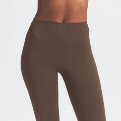 NikeSKIMS MATTE V-LINE 26" LEGGING | DARK SEPIA ON A MODEL FRONT VIEW