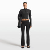NikeSKIMS MATTE FOLDOVER SLIM FLARE LEGGING | OBSIDIAN ON A MODEL FRONT VIEW @ | FOCUS: 0.0, 1.0, 0.9