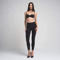 SKIMS BODY BUTT ENHANCING PADDED LEGGING | ONYX ON A MODEL FRONT VIEW