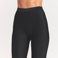SKIMS BODY HIGH-WAISTED FLARE PANT | ONYX ON A MODEL SIDE VIEW @
