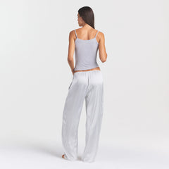 WOVEN SHINE LACE PANT | SILVER TRIPLE PINSTRIPE ON A MODEL SIDE VIEW @ | FOCUS: 0.0, 1.0, 0.9