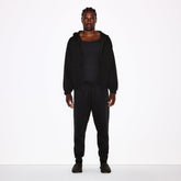 FLEECE LOUNGE MENS TAPERED JOGGER | WASHED ONYX ON A MODEL FRONT VIEW @ | FOCUS: 0.0, 1.0, 0.9