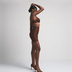 SKIMS BODY CORE SCULPT MID RISE SHORT | COCOA ON A MODEL SIDE VIEW