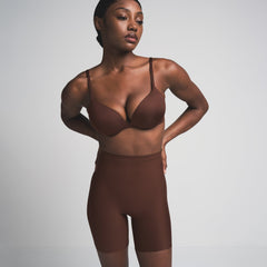 SKIMS BODY CORE SCULPT MID RISE SHORT | COCOA ON A MODEL FRONT VIEW