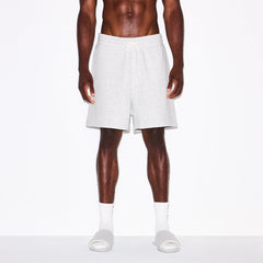 FLEECE LOUNGE MENS RELAXED SHORT | LIGHT HEATHER GREY ON A MODEL SIDE VIEW @ | FOCUS: 0.0, 1.0, 0.9
