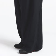 NikeSKIMS WOVEN NYLON OVERSIZED TRACK PANT | OBSIDIAN ON A MODEL SIDE VIEW @ | FOCUS: 0.0, 1.0, 0.9