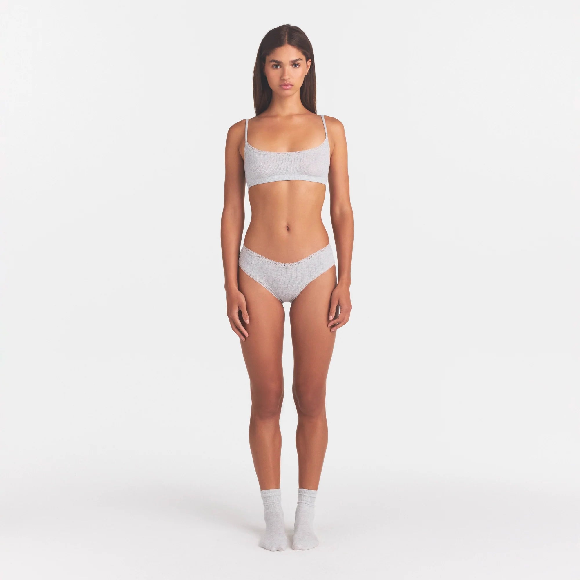 LIGHTWEIGHT COTTON POINTELLE LACE BRIEF | LIGHT HEATHER GREY ON A MODEL FRONT VIEW