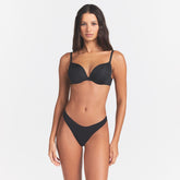 SKIMS ULTIMATE TEARDROP T-SHIRT BRA | ONYX ON A MODEL SIDE VIEW @ | FOCUS: 0.0, 1.0, 0.9