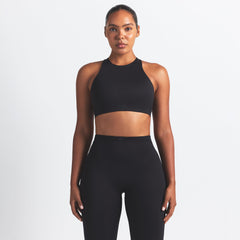NikeSKIMS MATTE HIGH NECK BRA | OBSIDIAN ON A MODEL FRONT VIEW