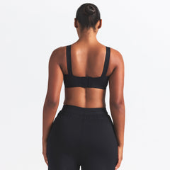 NikeSKIMS MATTE WIDE STRAP BRA | OBSIDIAN ON A MODEL BACK VIEW