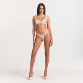 ULTRA FINE MESH RUFFLE BRA | IVORY ON A MODEL FRONT VIEW @ | FOCUS: 0.0, 1.0, 0.9