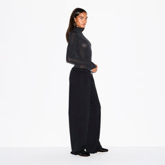 SHEER MODAL LONG SLEEVE TURTLENECK BODYSUIT | ONYX ON A MODEL FRONT VIEW @ | FOCUS: 0.0, 1.0, 0.9