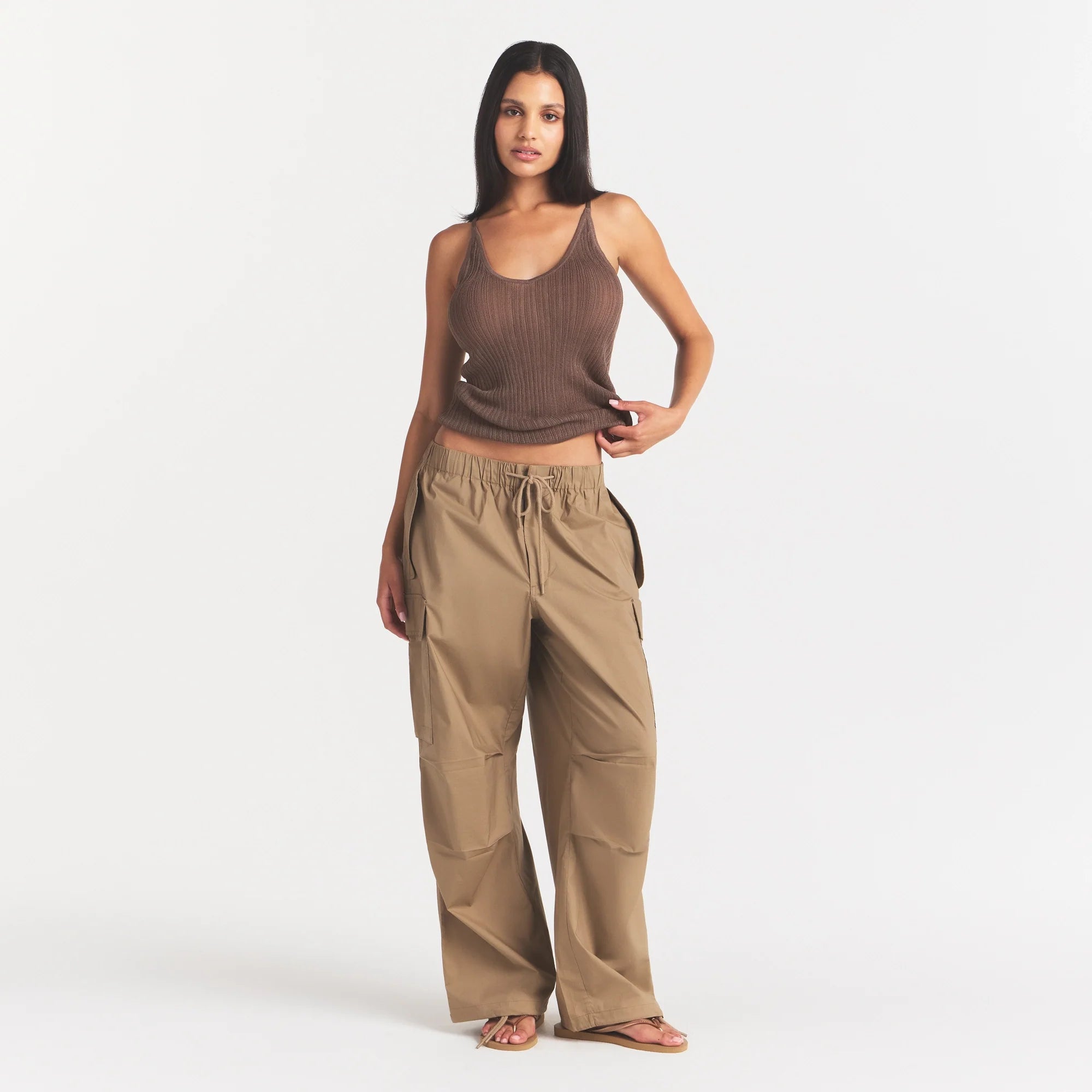WOVEN COTTON OVERSIZED LOW RISE CARGO PANT | DESERT ON A MODEL FRONT VIEW @ | FOCUS: 0.0, 1.0, 0.9