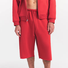 FLEECE LOUNGE MENS RELAXED LONG SHORT | WASHED RED ON A MODEL SIDE VIEW @ | FOCUS: 0.0, 1.0, 0.9