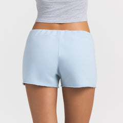 DRAPEY FRENCH TERRY SHORT | POWDER BLUE ON A MODEL SIDE VIEW @ | FOCUS: 0.0, 1.0, 0.9