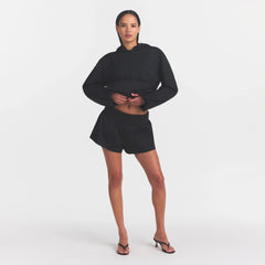WOVEN COTTON FLUTTER SHORT | ONYX ON A MODEL FRONT VIEW @ | FOCUS: 0.0, 1.0, 0.9