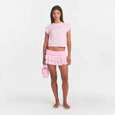 SHEER KNIT RUFFLE MINI SKIRT | PEONY ON A MODEL FRONT VIEW @ | FOCUS: 0.0, 1.0, 0.9