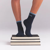 RIBBED QUARTER CREW LOGO SOCK | NAVY AND KYANITE ON A MODEL | FOCUS: 0.0, 1.0, 0.9