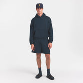 SKIMS ACCESSORIES MENS BASEBALL CAP | NAVY ON A MODEL FRONT VIEW @ | FOCUS: 0.0, 1.0, 0.9