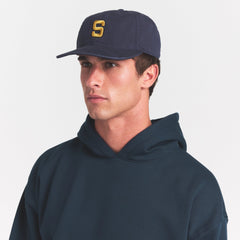 SKIMS ACCESSORIES MENS BASEBALL CAP | NAVY ON A MODEL SIDE VIEW @ | FOCUS: 0.0, 1.0, 0.9