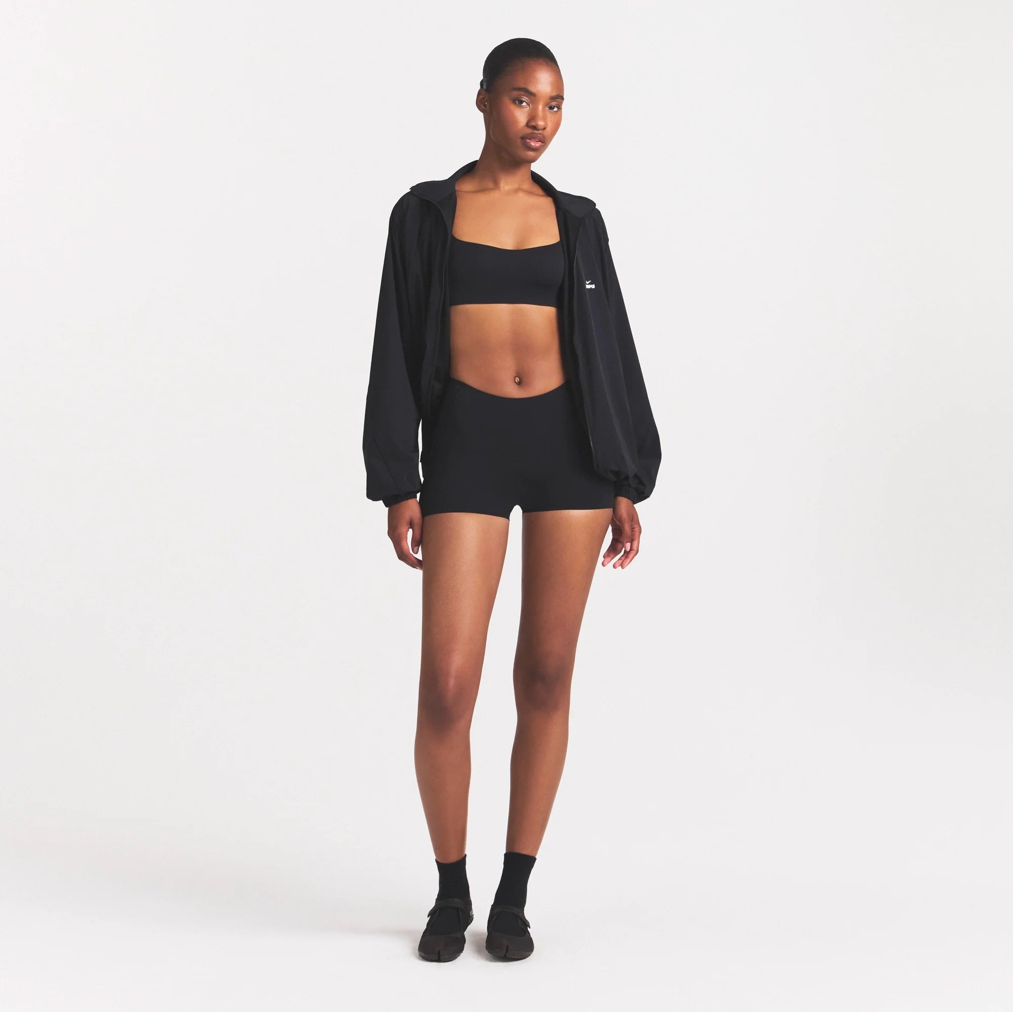 NikeSKIMS STUDIO STRETCH DIP FRONT 2" SHORT | OBSIDIANON A MODEL FRONT