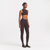 NikeSKIMS STUDIO STRETCH DIP FRONT 29" LEGGING | DARK ROASTON A MODEL FRONT