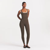 NikeSKIMS MATTE CORSET 29" ONE PIECE | DARK SEPIA ON A MODEL