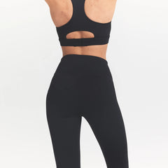 NikeSKIMS MATTE CROP 17" LEGGING | OBSIDIAN ON A MODEL BACK VIEW @ | FOCUS: 0.0, 1.0, 0.9