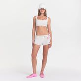 NikeSKIMS MATTE SCOOP NECK BRA | DITSY FLORAL PRINT ON A MODEL