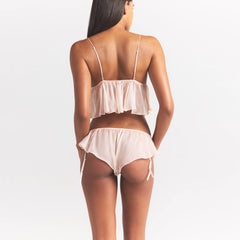 SKIMS ROMANCE BABYDOLL AND GARTER HIPSTER SET | PRIMROSE ON A MODEL SIDE VIEW @ | FOCUS: 0.0, 1.0, 0.9