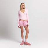 COTTON JERSEY LONG SLEEVE DEEP PLUNGE TOP | CHERRY BLOSSOM ON A MODEL FRONT VIEW S | FOCUS: 0.0, 1.0, 0.9