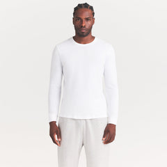 SKIMS COTTON MENS CLASSIC LONG SLEEVE T-SHIRT | CHALK ON A MODEL SIDE VIEW | FOCUS: 0.0, 1.0, 0.9