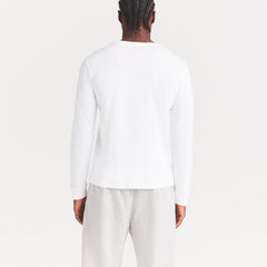 SKIMS COTTON MENS CLASSIC LONG SLEEVE T-SHIRT | CHALK ON A MODEL SIDE VIEW | FOCUS: 0.0, 1.0, 0.9