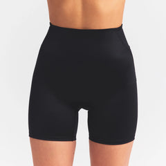 NikeSKIMS SATIN SHINE BONDED WAIST 5" BIKER SHORT | OBSIDIAN ON A MODEL SIDE VIEW