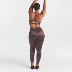 NikeSKIMS SATIN SHINE BONDED WAIST 26" LEGGING | RESIN ON A MODEL FRONT VIEW