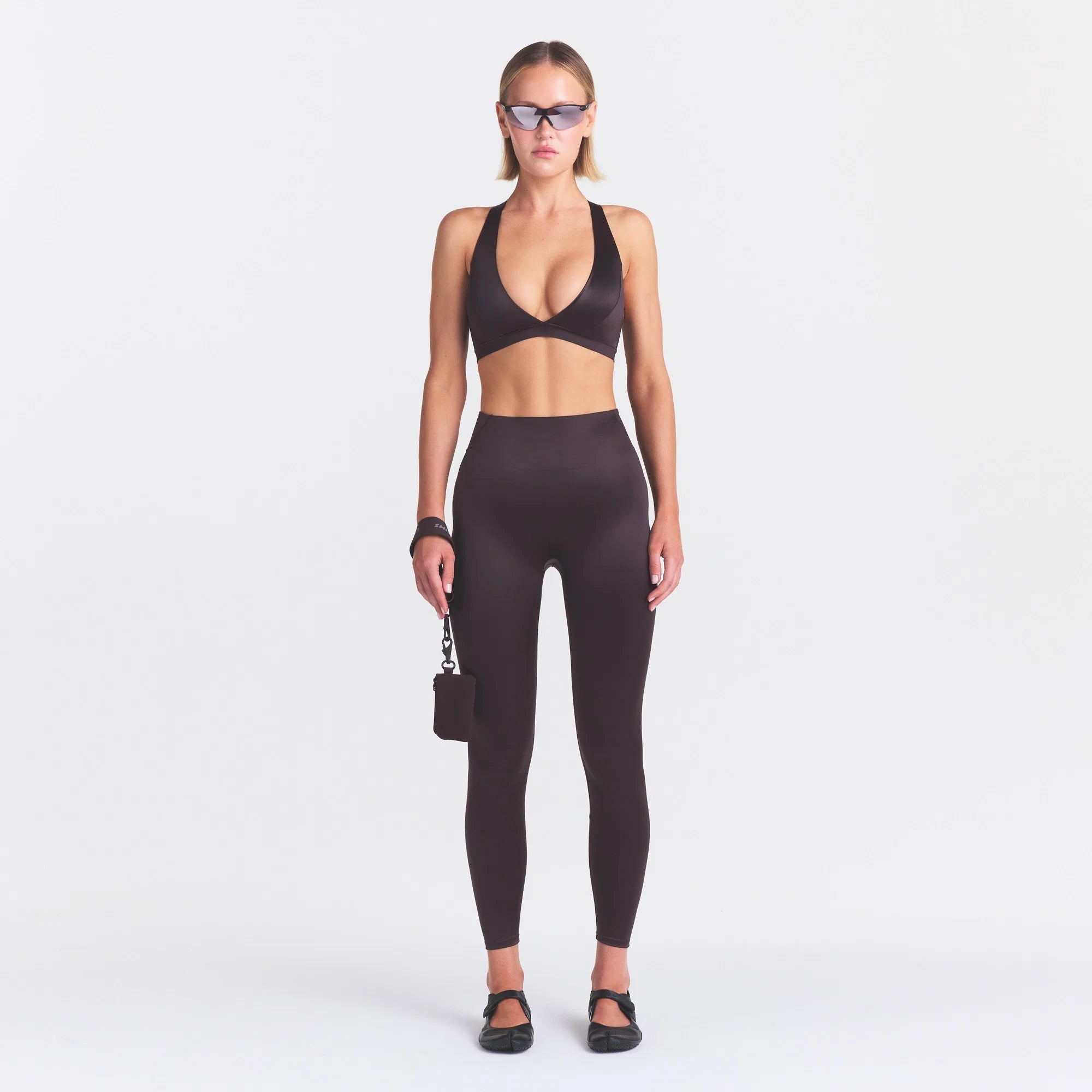 NikeSKIMS SATIN SHINE BONDED WAIST LEGGING 26" | PHOENIX ON A MODEL FRONT VIEW