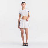 NikeSKIMS STRETCH KNIT DOLPHIN SHORT | IVORY ON A MODEL FRONT VIEW @ | FOCUS: 0.0, 1.0, 0.9