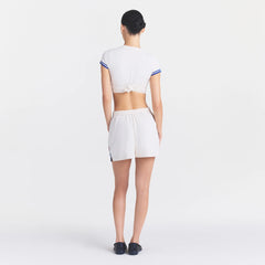 NikeSKIMS STRETCH KNIT DOLPHIN SHORT | IVORY ON A MODEL FRONT VIEW @ | FOCUS: 0.0, 1.0, 0.9