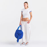 NikeSKIMS STRETCH KNIT BALLOON PANT | IVORY ON A MODEL FRONT VIEW @ | FOCUS: 0.0, 1.0, 0.9