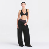 NikeSKIMS STRETCH KNIT WIDE LEG PANT | OBSIDIAN ON A MODEL FRONT VIEW @ | FOCUS: 0.0, 1.0, 0.9