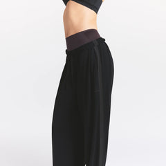 NikeSKIMS STRETCH KNIT WIDE LEG PANT | OBSIDIAN ON A MODEL SIDE VIEW @ | FOCUS: 0.0, 1.0, 0.9