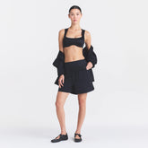 NikeSKIMS STRETCH NYLON 5" TRACK SHORT | OBSIDIAN ON A MODEL FRONT VIEW