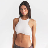 NikeSKIMS RIBBED SEAMLESS RACER FRONT BRA | IVORY ON A MODEL SIDE VIEW @ | FOCUS: 0.0, 1.0, 0.9