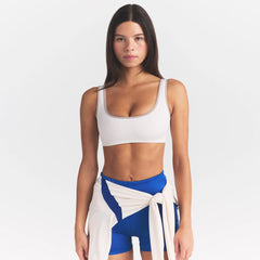 NikeSKIMS RIBBED SEAMLESS MICRO SCOOP BRA | IVORY ON A MODEL SIDE VIEW @ | FOCUS: 0.0, 1.0, 0.9
