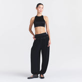 NikeSKIMS SATIN SHINE HIGH NECK BRA | OBSIDIAN ON A MODEL FRONT VIEW @ | FOCUS: 0.0, 1.0, 0.9
