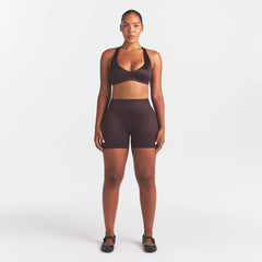 NikeSKIMS SATIN SHINE PLUNGE T-BACK BRA | PHOENIX ON A MODEL FRONT VIEW @ | FOCUS: 0.0, 1.0, 0.9