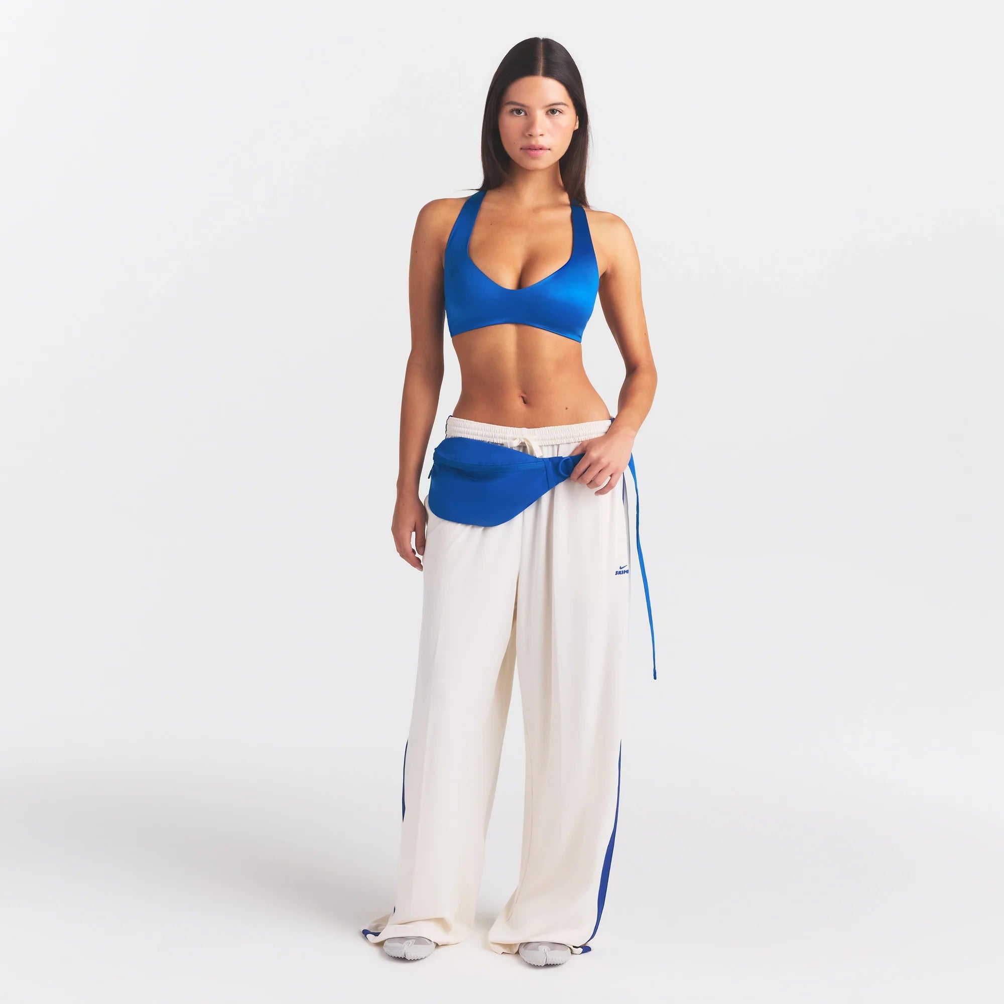 NikeSKIMS SATIN SHINE PLUNGE T-BACK BRA | COBALT ON A MODEL FRONT VIEW @ | FOCUS: 0.0, 1.0, 0.9